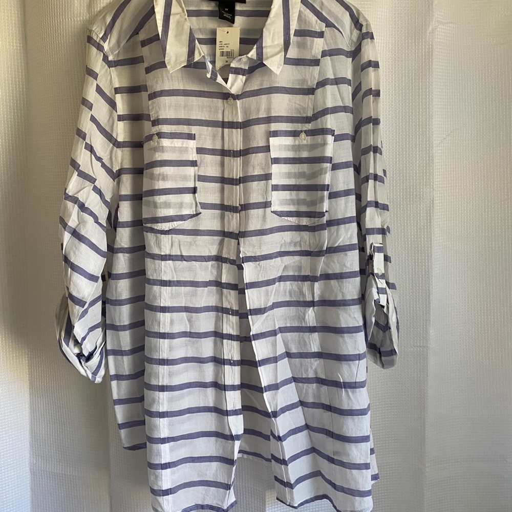 White and purple striped shirt.